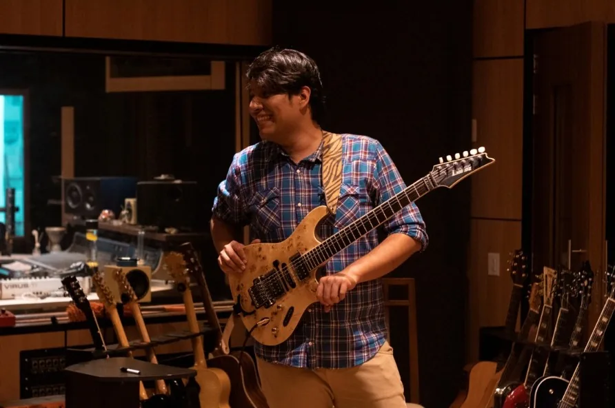Luis Betancourt guitarist recording in the studio